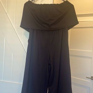 Black jumpsuit. Brand is Bebop (Buckle). Size M